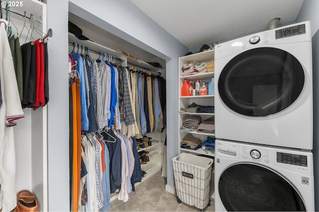 620 N Hayden Bay Dr, Portland, OR 97217 - laundry room with stacked washer and clothes dryer and light carpet