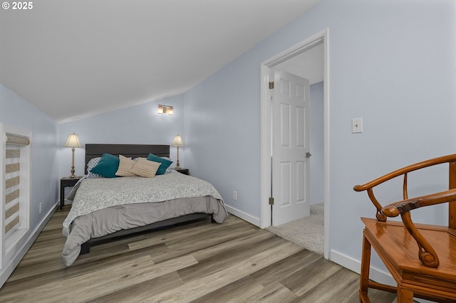 620 N Hayden Bay Dr, Portland, OR 97217 - bedroom featuring wood finished floors, lofted ceiling, and baseboards