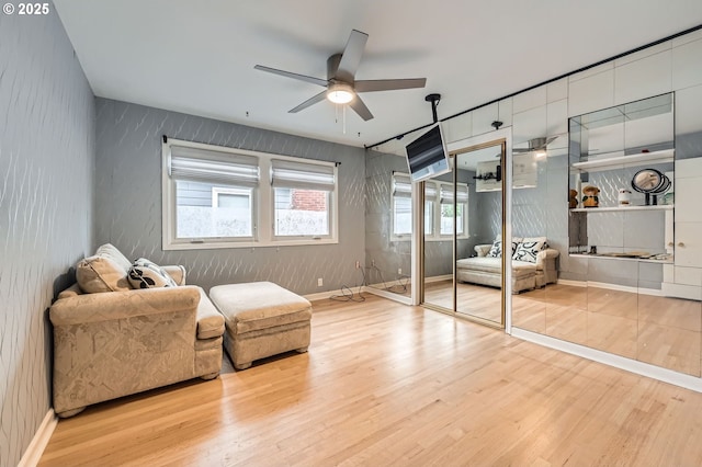 1805 NE Saratoga St, Portland, OR 97211 - living area featuring ceiling fan, wood finished floors, and baseboards