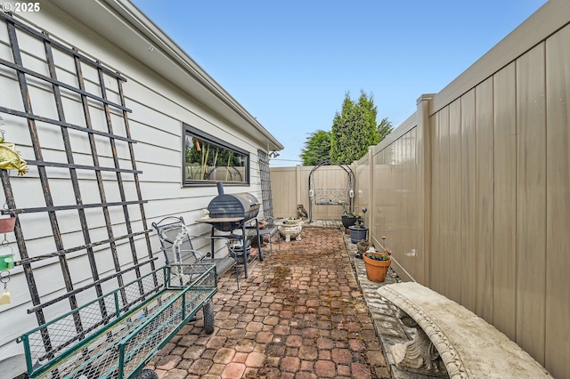 1805 NE Saratoga St, Portland, OR 97211 - fenced backyard with a patio area and a grill
