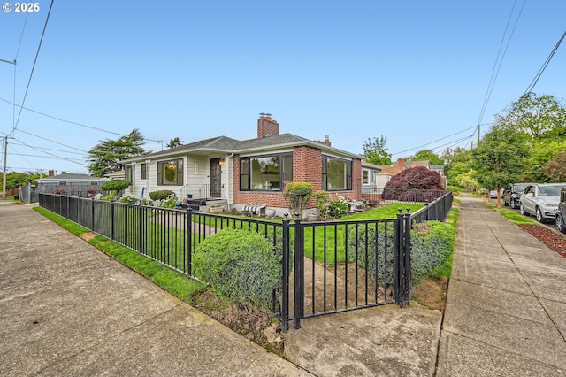 1805 NE Saratoga St, Portland, OR 97211 - bungalow-style home with brick siding, a fenced front yard, and a chimney