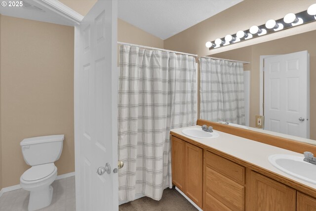 full bathroom featuring double vanity, toilet, and a shower with curtain