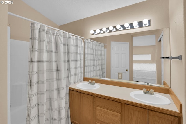 full bathroom featuring connected bathroom, double vanity, and curtained shower