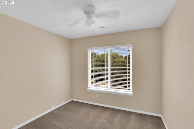 empty room featuring carpet, baseboards, a textured ceiling, and ceiling fan