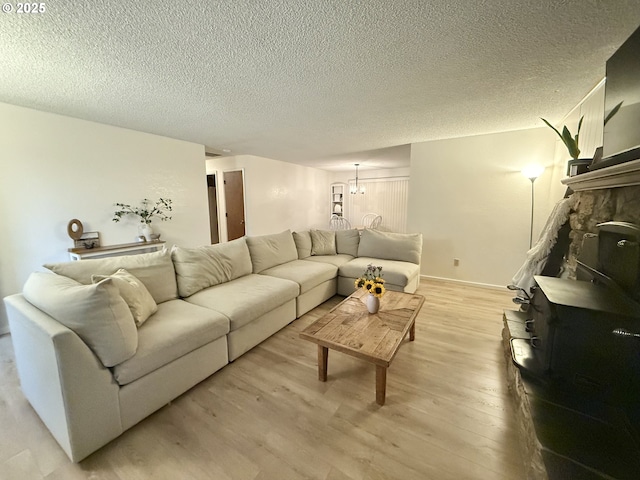 1689 NW Martin Ave, Roseburg, OR 97471 - living room with light wood-style floors, a textured ceiling, and a chandelier