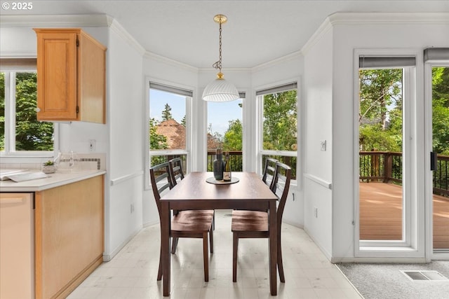 16605 SW Sumac St, Beaverton, OR 97007 - dining room featuring plenty of natural light, light flooring, baseboards, and ornamental molding