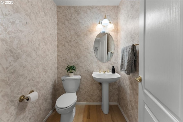 16605 SW Sumac St, Beaverton, OR 97007 - bathroom featuring wood finished floors, toilet, and baseboards