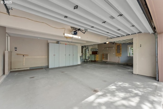 16605 SW Sumac St, Beaverton, OR 97007 - garage with secured water heater, a garage door opener, and electric panel