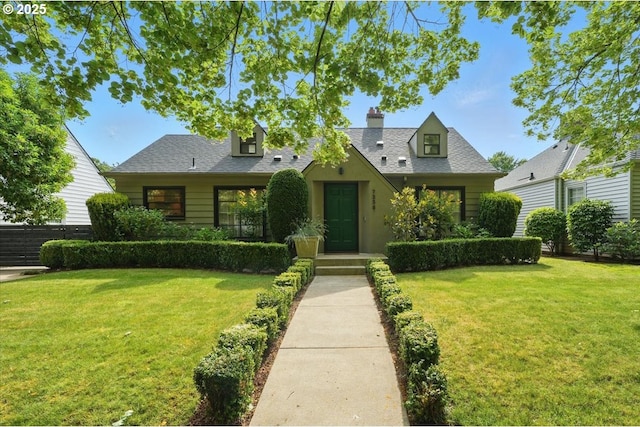 7338 N Chase Ave, Portland, OR 97217 - view of front of property with a front yard and a chimney