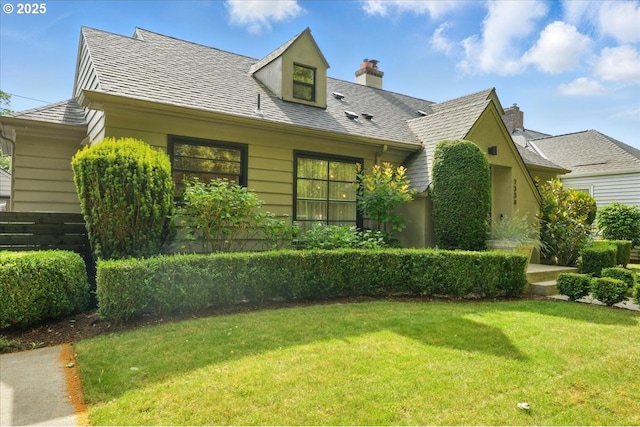 7338 N Chase Ave, Portland, OR 97217 - view of front of home with a front lawn and a chimney