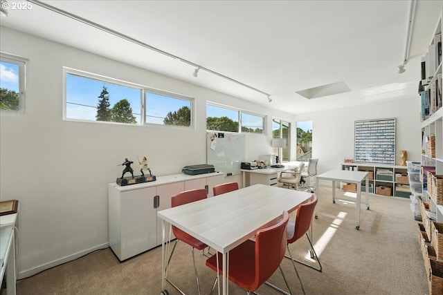 7338 N Chase Ave, Portland, OR 97217 - carpeted dining area featuring track lighting