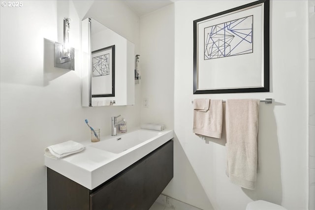 7338 N Chase Ave, Portland, OR 97217 - bathroom featuring vanity and marble look tiles