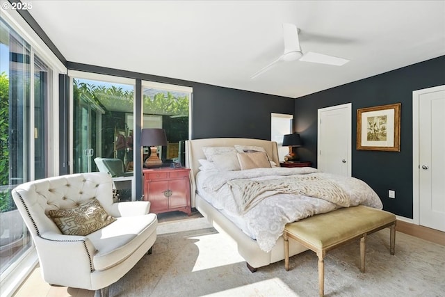 7338 N Chase Ave, Portland, OR 97217 - bedroom featuring multiple windows, wood finished floors, and a ceiling fan