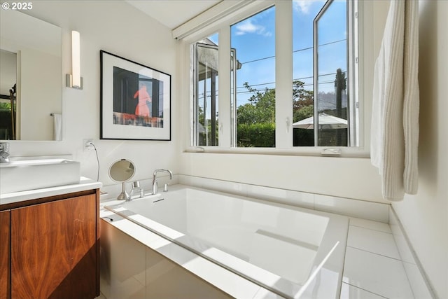 7338 N Chase Ave, Portland, OR 97217 - full bath featuring vanity, a garden tub, and tile patterned flooring
