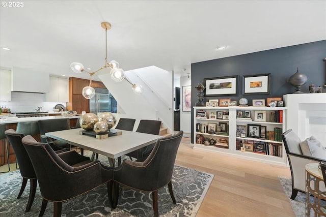 7338 N Chase Ave, Portland, OR 97217 - dining room featuring light wood finished floors and recessed lighting