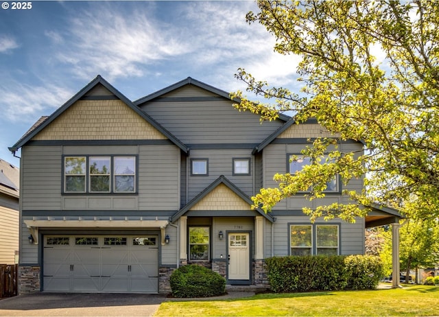 7760 SW Hyland Way, Beaverton, OR 97008 - craftsman-style house featuring a garage, driveway, a front yard, and stone siding