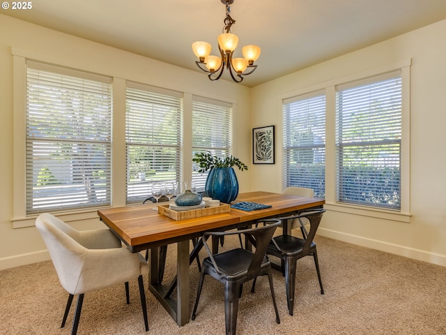 7760 SW Hyland Way, Beaverton, OR 97008 - dining space with a chandelier, plenty of natural light, light colored carpet, and baseboards