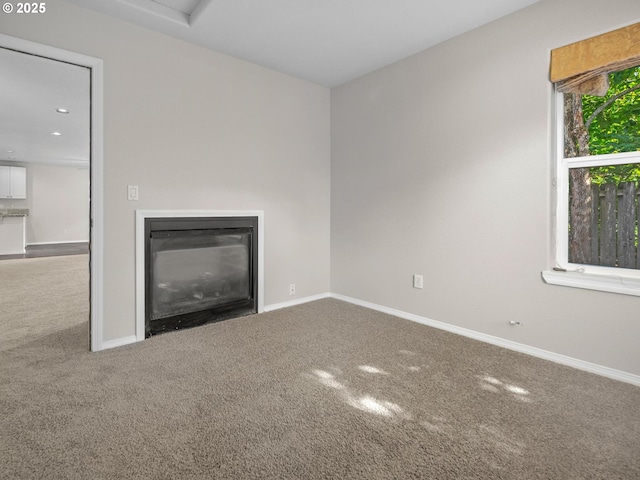 unfurnished living room with carpet