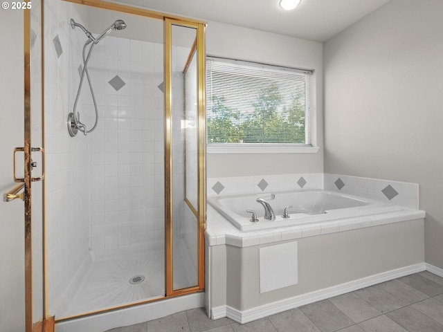 bathroom featuring plus walk in shower and tile patterned floors