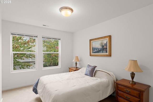 bedroom featuring carpet flooring and baseboards