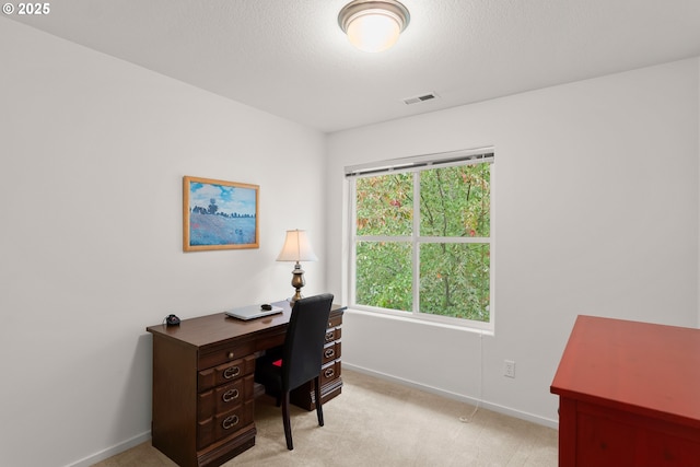 office area featuring light colored carpet and baseboards