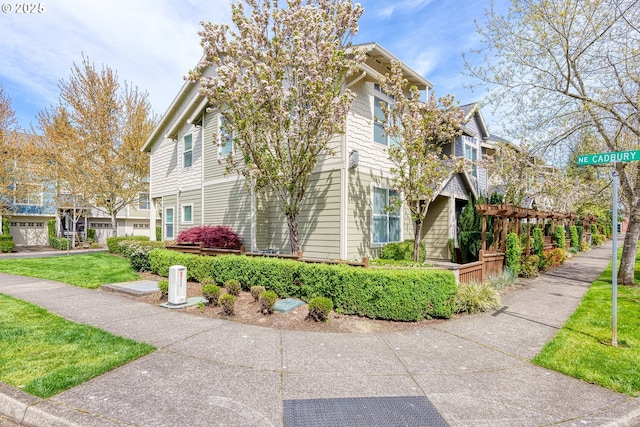 view of side of home featuring a lawn