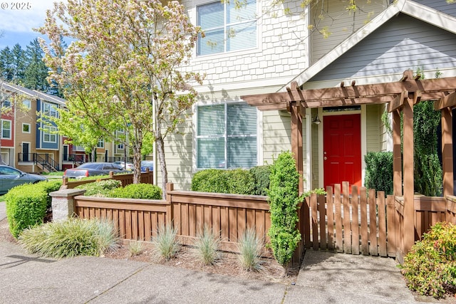 view of front of house with fence