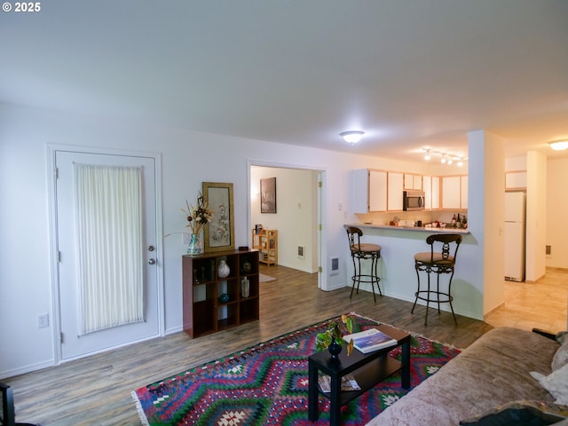 living area with wood finished floors