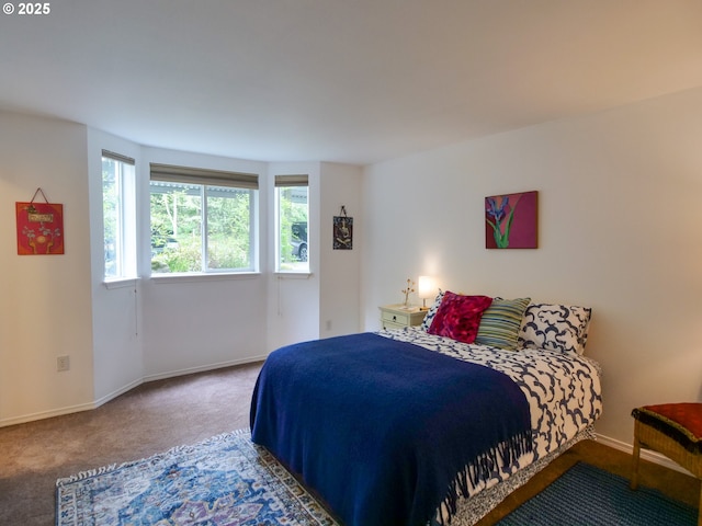carpeted bedroom with baseboards