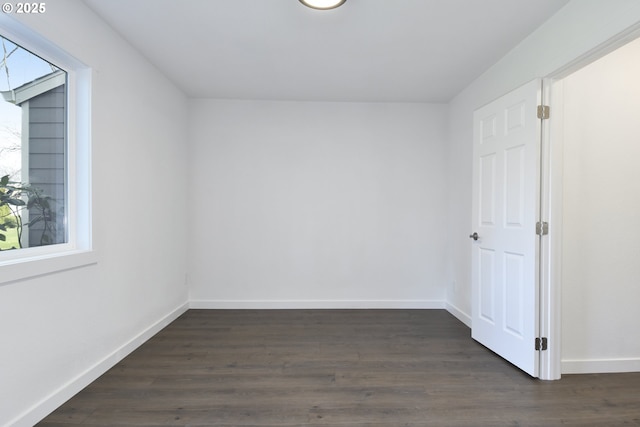2718 SE 138th Ave Unit 64, Portland, OR 97236 - additional living space with baseboards and dark wood-style flooring