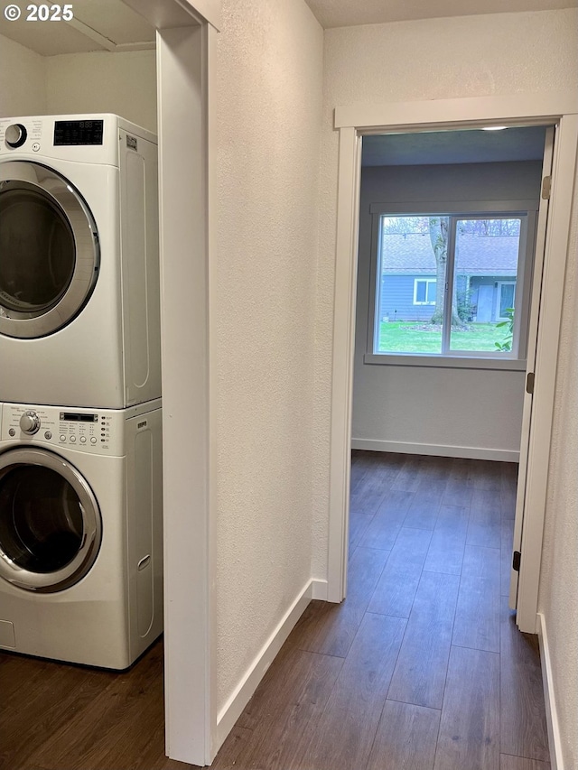 2718 SE 138th Ave Unit 64, Portland, OR 97236 - laundry room featuring stacked washer / dryer, dark wood-type flooring, baseboards, and a textured wall