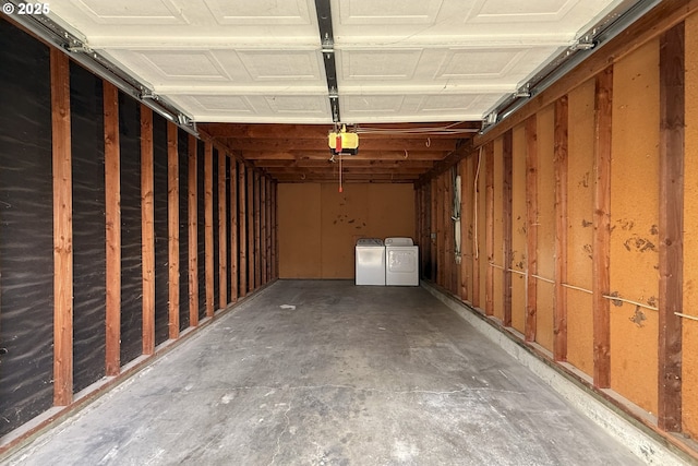2718 SE 138th Ave Unit 64, Portland, OR 97236 - garage with washer and clothes dryer and a garage door opener
