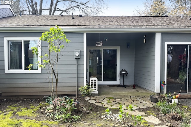 2718 SE 138th Ave Unit 64, Portland, OR 97236 - back of house featuring roof with shingles and a patio