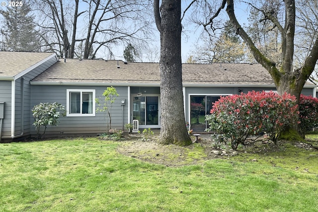 2718 SE 138th Ave Unit 64, Portland, OR 97236 - rear view of property featuring roof with shingles and a yard