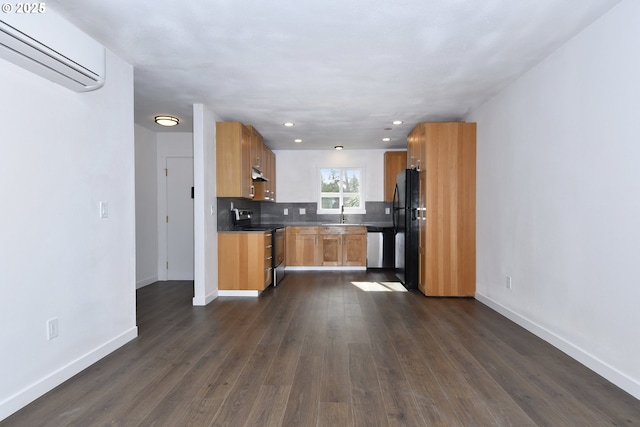 2718 SE 138th Ave Unit 64, Portland, OR 97236 - kitchen with stainless steel appliances, a wall mounted AC, baseboards, dark wood-style flooring, and tasteful backsplash