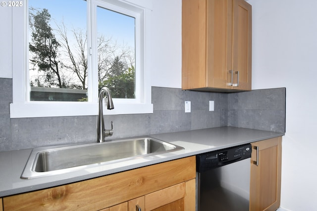 2718 SE 138th Ave Unit 64, Portland, OR 97236 - kitchen with stainless steel dishwasher, a sink, tasteful backsplash, light countertops, and plenty of natural light