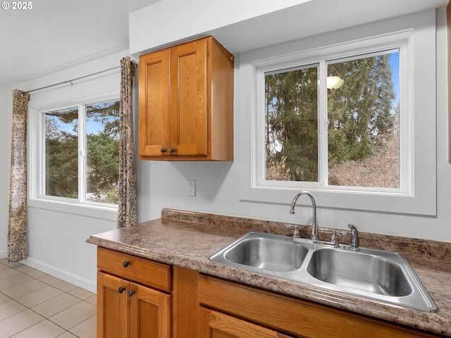 kitchen with sink and light tile patterned floors