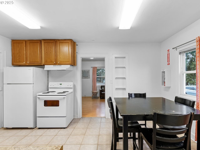 kitchen featuring white appliances and light tile patterned floors