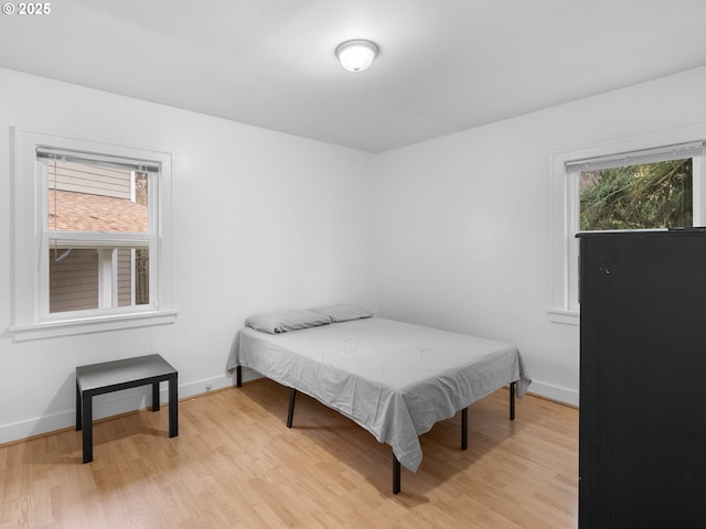 bedroom featuring billiards and light hardwood / wood-style floors