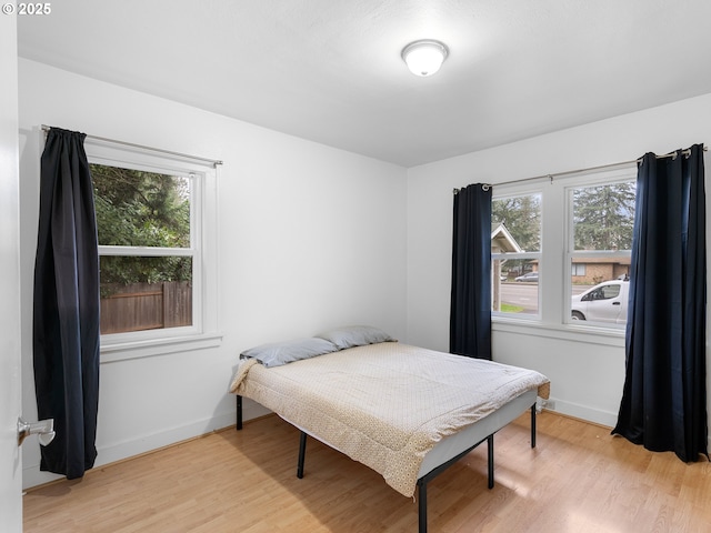 bedroom with light wood-type flooring