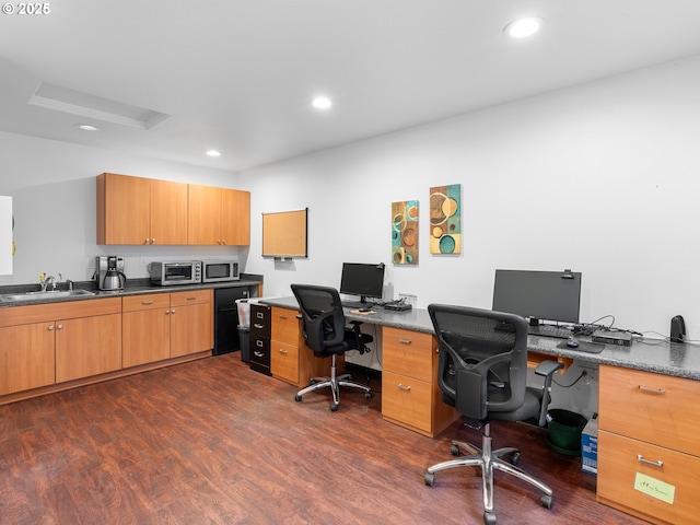 home office with sink and dark hardwood / wood-style floors