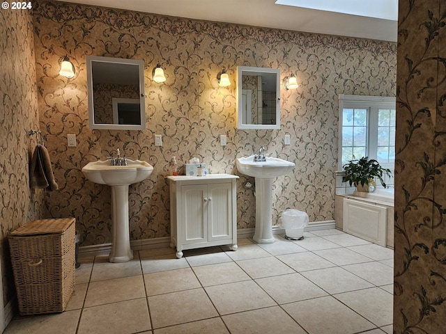42139 Dry Gulch Rd, Richland, OR 97870 - full bathroom featuring tile patterned floors, two sinks, and baseboards