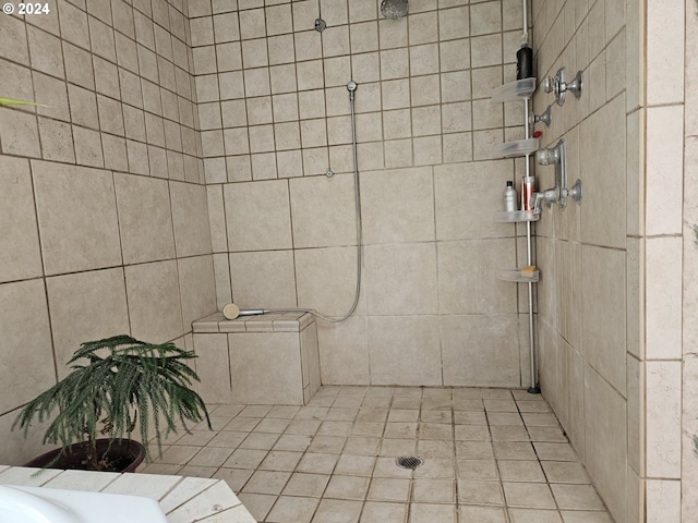 bathroom with a tile shower