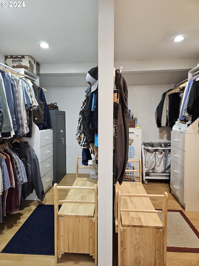 walk in closet featuring wood finished floors