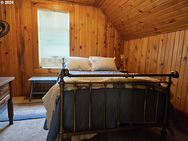 carpeted bedroom with lofted ceiling, wood walls, and wooden ceiling