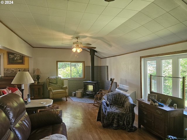 42139 Dry Gulch Rd, Richland, OR 97870 - living room with a wood stove, wood finished floors, ceiling fan, ornamental molding, and lofted ceiling
