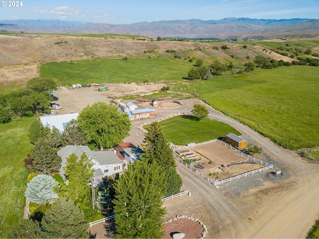 birds eye view of property featuring a rural view and a mountain view