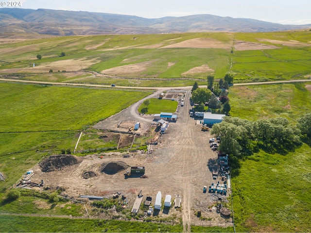 drone / aerial view featuring a rural view and a mountain view