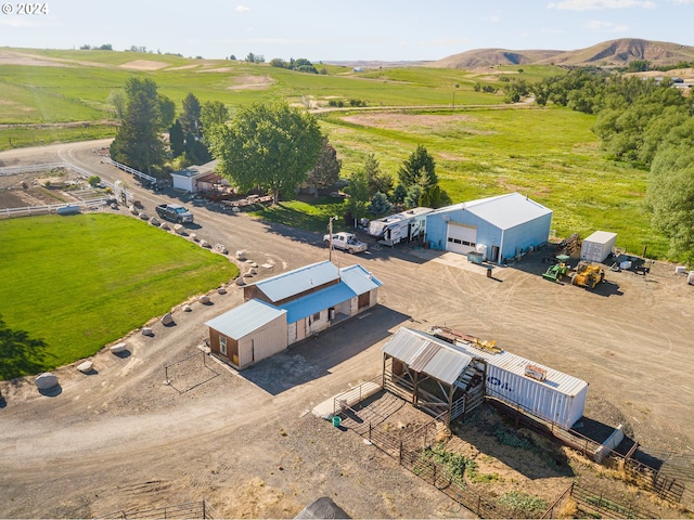 bird's eye view featuring a rural view and a mountain view