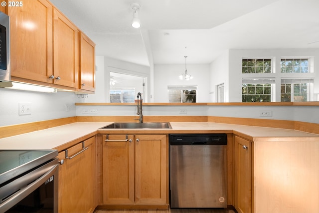 kitchen with sink, dishwasher, range, a chandelier, and hanging light fixtures